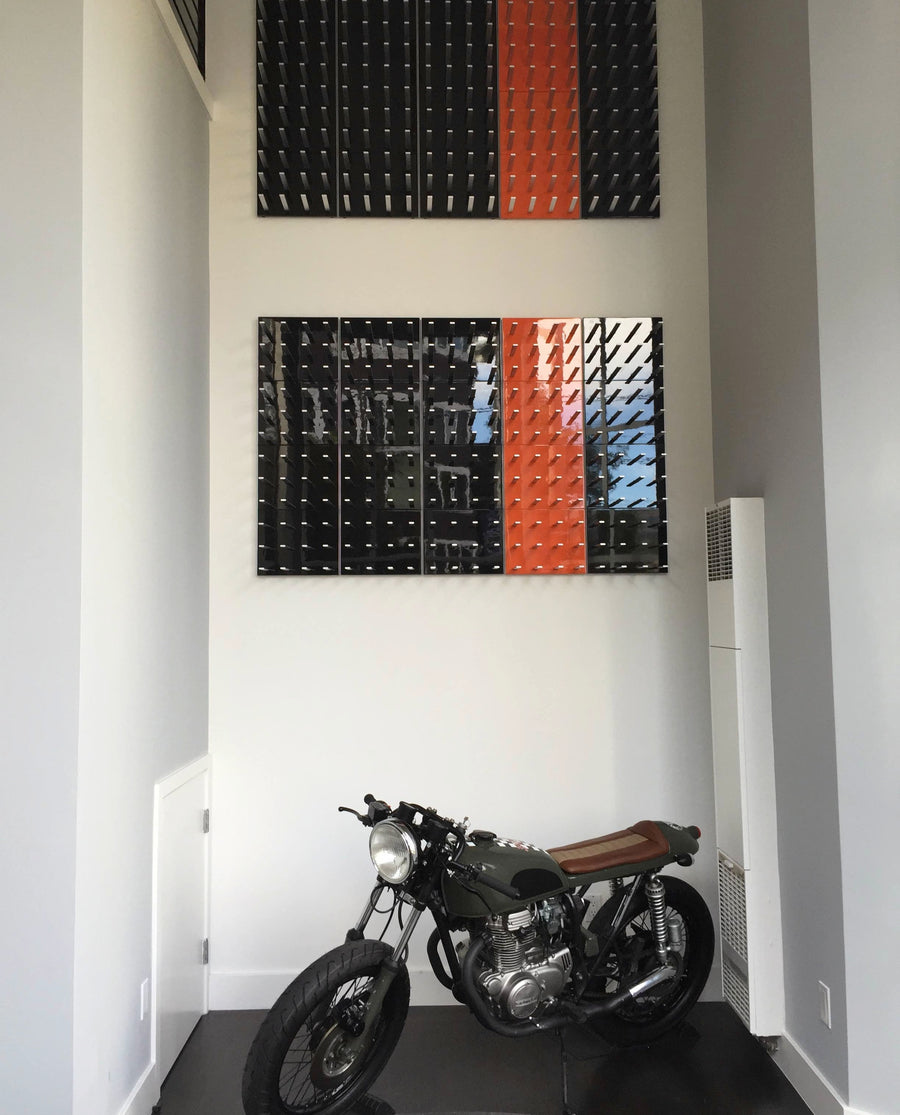 vinreoler i sort og orange med motorcykel
