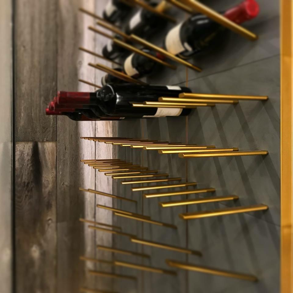 concrete wine rack with brass hardware